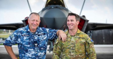 Air Force aircraft technician Sergeant Steven Grant, left, and airfield defence guard Leading Aircraftman Jason Grant, who are also father and son, catch up during Exercise Cope North at Andersen Air Force Base, Guam. Story by Flying Officer Bronwyn Marchant. Photo by Leading Aircraftman Sam Price.