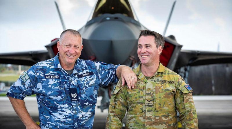 Air Force aircraft technician Sergeant Steven Grant, left, and airfield defence guard Leading Aircraftman Jason Grant, who are also father and son, catch up during Exercise Cope North at Andersen Air Force Base, Guam. Story by Flying Officer Bronwyn Marchant. Photo by Leading Aircraftman Sam Price.