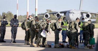 Royal Australian Air Force air movements personnel assist Republic of Fiji Military Forces engineers and medical personnel bound for Tonga to a C-130J Hercules aircraft at RAAF Base Amberley in Queensland. Story by Flying Officer Robert Hodgson. Photo by Leading Aircraftwoman Kate Czerny.