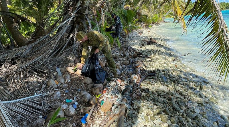 HMAS Glenelg personnel clean-up a beach on Direction Island, which is part of the Cocos (Keeling) Islands group, during their recent Operation Resolute deployment. Story by Lieutenant Gordon Carr-Gregg. Photo by Sub Lieutenant Luke Bennet.