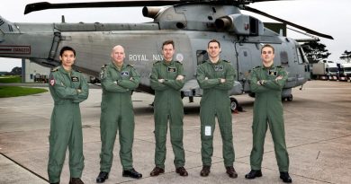 Royal Australian Navy pilot Lieutenant Dan Cochrane, left, and the Royal Navy Merlin Mark 2 helicopter crew that rescued a kayaker off Cornwall in southern England. Story by Graeme Wilkinson, Acting Public Relations Officer, Royal Navy. Photo by Royal Navy.