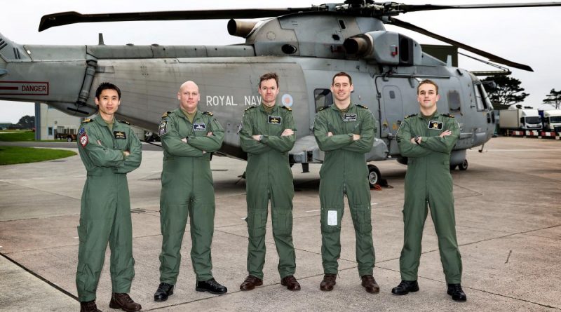 Royal Australian Navy pilot Lieutenant Dan Cochrane, left, and the Royal Navy Merlin Mark 2 helicopter crew that rescued a kayaker off Cornwall in southern England. Story by Graeme Wilkinson, Acting Public Relations Officer, Royal Navy. Photo by Royal Navy.