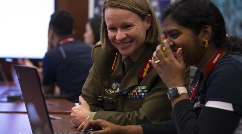 Head of Information Warfare Major General Susan Coyle meets Australian Defence Force Cyber Gap Program participant Shobita during the 2021 'capture the flag' cyber skills challenge in Canberra. Story by Bernadette Wright. Photo by Corporal Julia Whitwell.