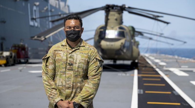 Army soldier Sergeant Alefosio Kakala on the flight deck of HMAS Adelaide during Operation Tonga Assist 2022. Story by Leading Seaman David Cox & Sergeant Alefosio Kakala. Photo by Corporal Robert Whitmore.