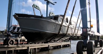 Former Air Force search and rescue boat O2-06 is pulled from the water at Lakes Entrance in Victoria for transport to an Air Force History and Heritage Branch facility in Spotswood, Melbourne. Photo by Flight Lieutenant Christopher Moon.