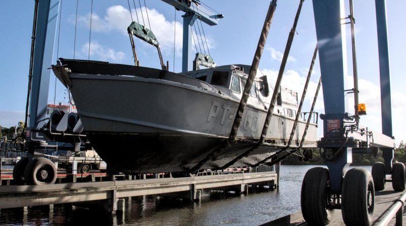 Former Air Force search and rescue boat O2-06 is pulled from the water at Lakes Entrance in Victoria for transport to an Air Force History and Heritage Branch facility in Spotswood, Melbourne. Photo by Flight Lieutenant Christopher Moon.