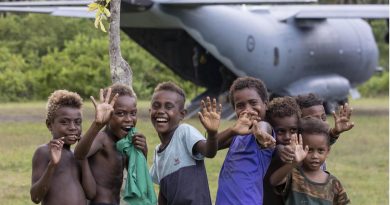 Solomon Islands children welcome an Air Force C-27J Spartan aircraft carrying food and critical aid supplies to Auki airport, Solomon Islands. Photo by Corporal Jarrad McAneney.