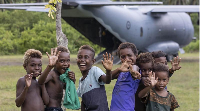 Solomon Islands children welcome an Air Force C-27J Spartan aircraft carrying food and critical aid supplies to Auki airport, Solomon Islands. Photo by Corporal Jarrad McAneney.