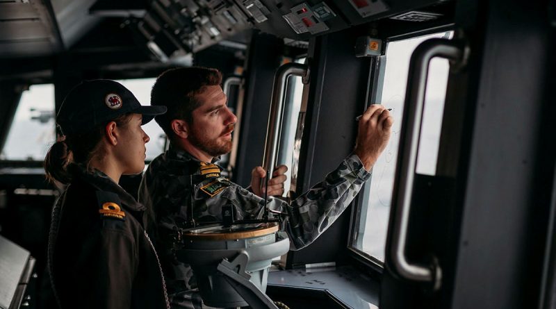 RAN navigator Lieutenant Dean Gilbert mentors Sub Lieutenant Annabelle Wall (left) as she conducts duties as assistant officer of the watch on the bridge of HMAS Hobart. Story by Lieutenant Nancy Cotton. Photo by Able Seaman Jarryd Capper.