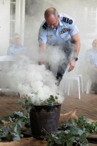 Chief of Air Force, Air Marshal Mel Hupfeld, AO, DSC, takes part in the smoking ceremony during the Air Force Elder handover ceremony at RAAF Base Glenbrook, NSW. Photo by Corporal Kylie Gibson.