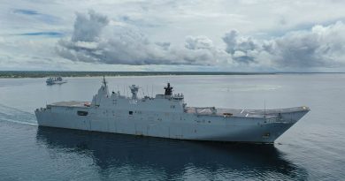 HMAS Canberra and HMAS Supply (left) sail into Nuku‘alofa harbour in Tonga as part of Operation Tonga Assist 2022. Photo by Petty Officer Christopher Szumlanski.