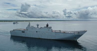 HMAS Canberra and HMAS Supply (left) sail into Nuku‘alofa harbour in Tonga as part of Operation Tonga Assist 2022. Photo by Petty Officer Christopher Szumlanski.