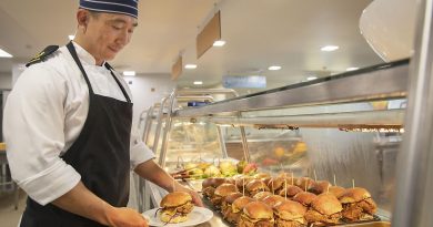 Royal Australian Navy catering supervisor Leading Seaman Tae Goh prepares to serve a Korean fried chicken burger at lunch in the HMAS Kuttabul main galley in Sydney. Story and photo by Corporal Jacob Joseph.