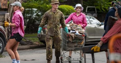 An Australian Army rifleman from 6th Battalion, Royal Australian Regiment, assists the local community to move flood-damaged belongings in St Lucia, Brisbane, during Operation Flood Assist 2022. Story by Lieutenant Nic Hawkins. Photo by Corporal Nicole Dorrett.