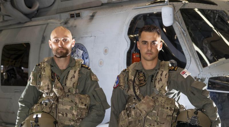 Leading Seamen Aircrew Michael Bennet (left) and Leading Seamen Aircrew Liam Sulley at 816 Squadron at HMAS Albatross, Nowra, after completing their rescue mission during Operation Flood Assist 2022. Story by Lieutenant Nancy Cotton. Photo by Leading Seaman Ryan Tascas.