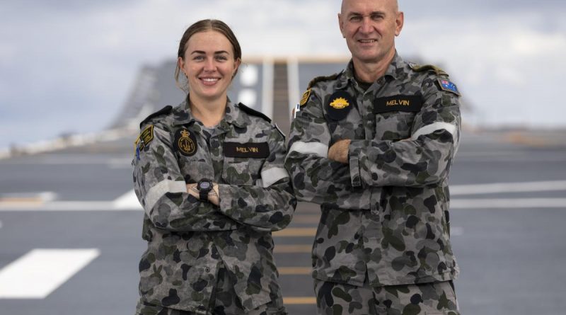 Army soldier Private Tim Melvin, right, reunites with his daughter, Navy sailor Leading Seaman Esther Melvin, on HMAS Canberra on Operation Tonga Assist 2022. Story by Lieutenant Brendan Trembath. Photo by Leading Seaman Daniel Goodman.