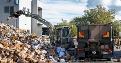 A soldier from 2nd/14th Light Horse Regiment (Queensland Mounted Infantry) removes flood-damaged produce from a cold storage warehouse at the Brisbane Markets in Rocklea. Story by Lieutenant Nic Hawkins. Photo by Corporal Nicole Dorrett.