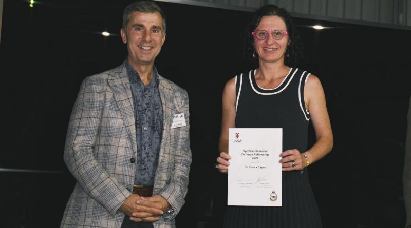 Air Commander Australia Air Vice-Marshal Joe Iervasi presents a certificate to Dr Bianca Capra as the Spitfire Memorial Defence Fellowship 2021 recipient during the 60th anniversary of the Spitfire Association. Story by Flight Lieutenant Dion Isaacson. Photo by Sergeant Oliver Carter.