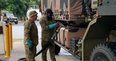 Private Tejinder Singh (right) and Private Leon Hooke of 9th Force Support Battalion prepare an Army truck for travel to Lismore in northern NSW to assist with clean-up efforts. Story by Captain Annie Richardson.