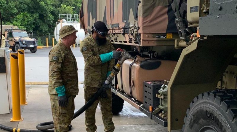 Private Tejinder Singh (right) and Private Leon Hooke of 9th Force Support Battalion prepare an Army truck for travel to Lismore in northern NSW to assist with clean-up efforts. Story by Captain Annie Richardson.