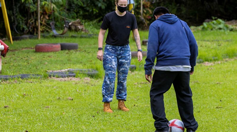 A RAAForce aviator plays soccer with Palau high school students during a community engagement activity as part of Operation Solania. Story by Flying Officer Lily Lancaster. Photo by Leading Seaman Nadav Harel.
