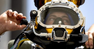 Royal Australian Navy sailor Able Seaman Clearance Diver Jake Phillips prepares to survey ferry terminal pylons along the Brisbane River as part of Operation Flood Assist 2022. Photo by Corporal Julia Whitwell.