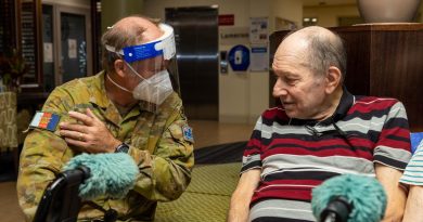 Corporal Mark Bennett with Rodney Crocker at the Pearl Retirement Village aged-care facility in Darwin. Photo by Corporal Rodrigo Villablanca.