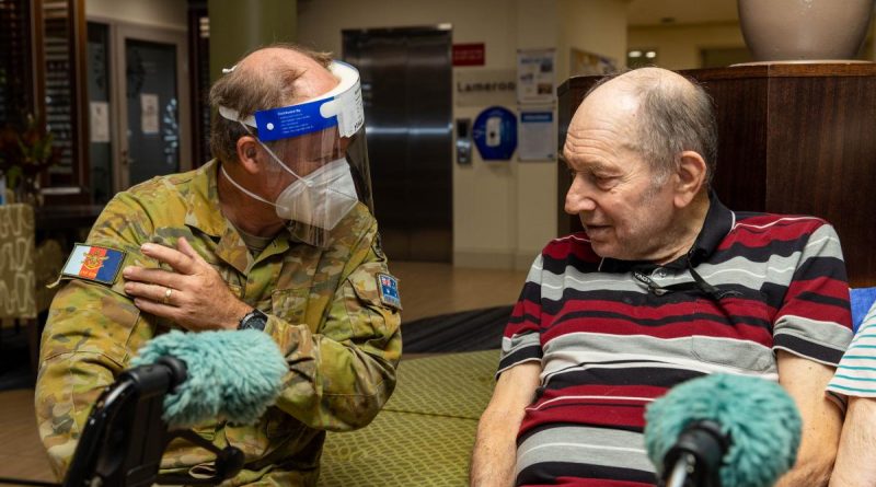 Corporal Mark Bennett with Rodney Crocker at the Pearl Retirement Village aged-care facility in Darwin. Photo by Corporal Rodrigo Villablanca.