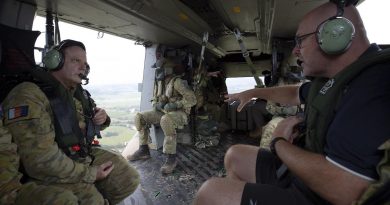 Major-General David Thomae and Mayor of Lismore Steve Krieg survey the damage and recovery efforts in Lismore from an Army MRH-90 Taipan. Story and photo by Warrant Officer Class 2 Max Bree.