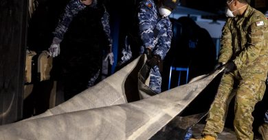 Air Force personnel remove flood-damaged carpet from Goodna Services Club, Brisbane, as part of Operation Flood Assist 2022. Story by Flight Lieutenant Tanya Carter. Photo: by Corporal Julia Whitwell.