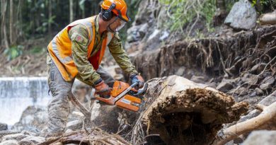 Army engineer Lance Corporal Jack Dalrymple assists Lismore Shire Council to clear debris from Mulgum Creek Weir in Nimbin, New South Wales, as part of Operation Flood Assist 2022. Story by Captain Catalina Martinez Pinto. Photo by Corporal Dustin Anderson.