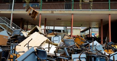 Australian Army soldiers from 1st Armoured Regiment remove flood-damaged equipment and furniture during a clean up of Richmond River High School in Lismore, New South Wales. Story by Captain Annie Richardson. Photo by Warrant Officer Class Two Max Bree.