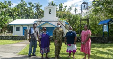 Australian Army pastor Chaplain Stephen Copland joins local parishioners outside Our Lady of Rosary Church in Angaur, Palau. Story by Flying Officer Lily Lancaster. Photo by Corporal David Cotton.