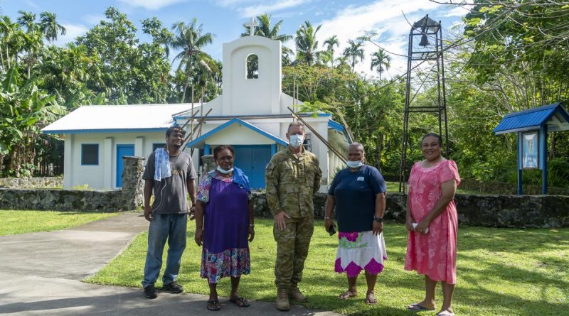 Australian Army pastor Chaplain Stephen Copland joins local parishioners outside Our Lady of Rosary Church in Angaur, Palau. Story by Flying Officer Lily Lancaster. Photo by Corporal David Cotton.