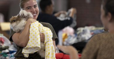 Corporal Rebecca Barry embraces a Casino local while organising donations at the local racecourse and showgrounds in northern NSW as part of Operation Flood Assist 2022. Story by Captain Annie Richardson. Photo by Corporal Sagi Biderman.