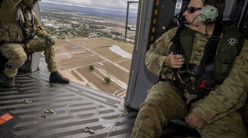 Commander of the Operation Flood Assist Joint Task Force, Lieutenant General David Thomae (right), surveys flood-affected areas in the greater Sydney region from an Army MRH-90 Taipan helicopter. Photo by Corporal Julia Whitwell.