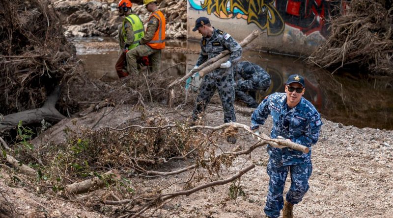 Navy, Army and Air Force personnel clear flood debris from Kedron Brook in Mitchelton, Brisbane, as part of Operation Flood Assist 2022. Story by Flying Officer Rob Hodgson. Photo by Corporal Nicole Dorrett.