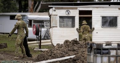 Australian Army soldiers assess and clear debris from Sackville Ski Gardens caravan park in Sydney as part of Operation Flood Assist 2022. Story by Lieutenant Edward Pym. Photo by Corporal Julia Whitwell.