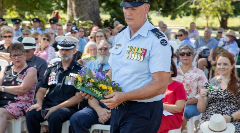 Wing Commander Shane Smith lays a wreath during the bombing of Katherine commemoration ceremony at Katherine, Northern Territory. Story by Flight Lieutenant Dee Irwin. Photo by Sergeant Pete Gammie.