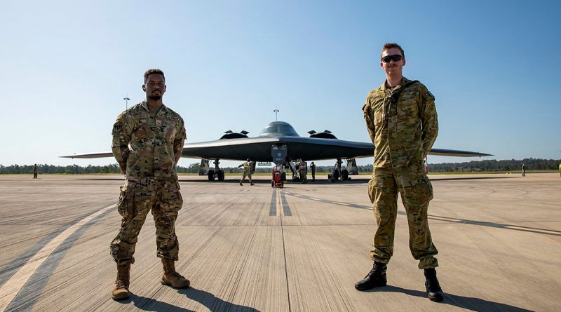 United States Air Force Senior Airman Reginald Dormeville from 509th Security Forces Squadron (left) and Royal Australian Air Force Aircraftman James Lunney from No. 2 Security Squadron in front of a United States Air Force B-2 Spirit aircraft from the 13th Bomb Squadron, at RAAF Base Amberley, Queensland. Photo by Leading Aircraftwoman Emma Schwenke.