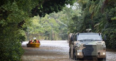 An Australian Army Bushmaster protected mobility vehicle moves through floodwaters while on standby to conduct evacuation tasks with the local SES in Lismore, New South Wales, in support of Operation Flood Assist 2022. Photo by Corporal Jonathan Goedhart.
