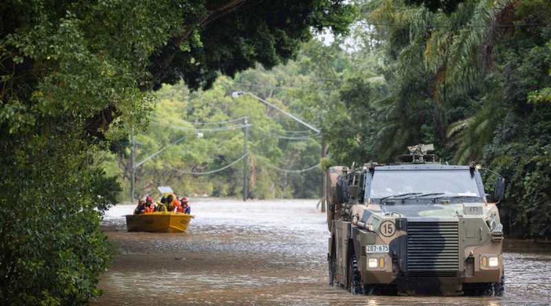 An Australian Army Bushmaster protected mobility vehicle moves through floodwaters while on standby to conduct evacuation tasks with the local SES in Lismore, New South Wales, in support of Operation Flood Assist 2022. Photo by Corporal Jonathan Goedhart.