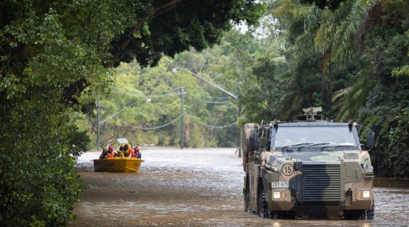 An Australian Army Bushmaster protected mobility vehicle moves through floodwaters while on standby to conduct evacuation tasks with the local SES in Lismore, New South Wales, in support of Operation Flood Assist 2022. Photo by Corporal Jonathan Goedhart.