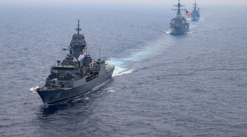 HMAS Arunta, left, sails in company with US Navy destroyer USS Momsen and Japan Maritime Self-Defense Force destroyer JS Yūdachi. Story by Lieutenant Commander Andrew Herring. Photo by US Navy Aicrewman Regnor Vondedenroth.