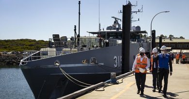 Assistant Minister for Defence Andrew Hastie (right) and Austal senior staff walk down a wharf at the Austal Ships shipyard in Henderson, Western Australia, on launch day for the second Cape-class patrol boat. Photo by Leading Seaman Craig Walton.