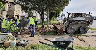 Royal Australian Air Force aviators from RAAF Base Amberley assist residents and Ipswich City Council with flood-relief efforts in Ipswich, Queensland, during Operation Flood Assist.