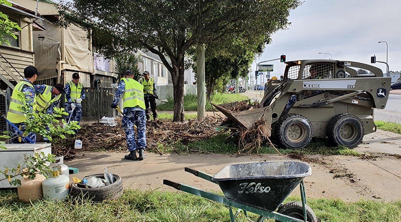 Royal Australian Air Force aviators from RAAF Base Amberley assist residents and Ipswich City Council with flood-relief efforts in Ipswich, Queensland, during Operation Flood Assist.