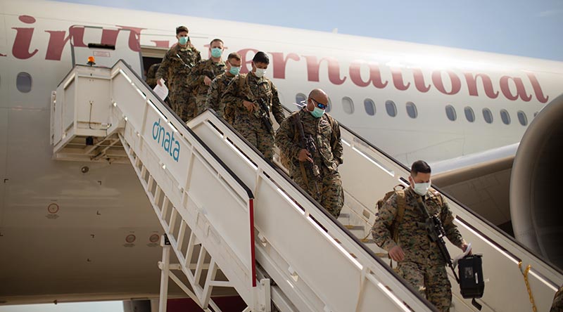 US Marines with the Command Element, 5th Marine Regiment, MRF-D 22 offload a Boeing 777 at Royal Australian Air Force Base Darwin, NT, Australia, 12 March 2022. US Marine Corps photo by Corporal Cedar Barnes.