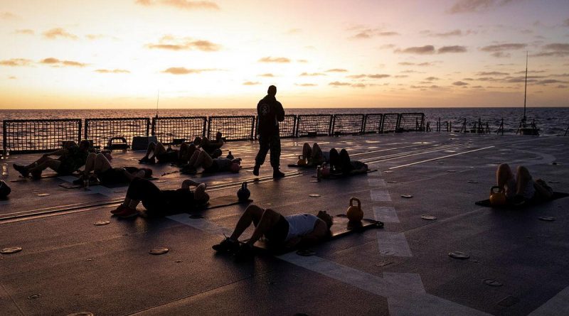 HMAS Hobart crew members attend a physical training session on board the ship. Story and photo by Leading Seaman Kylie Jagiello.