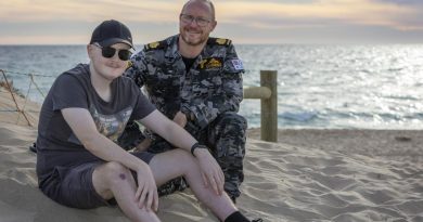 Warrant Officer Tim Cummins with his son, Jack, at Ship Wreck Bay in Golden Bay, Western Australia. Story by Petty Office Lee-Anne Cooper. Photo by Petty Officer Yuri Ramsey.